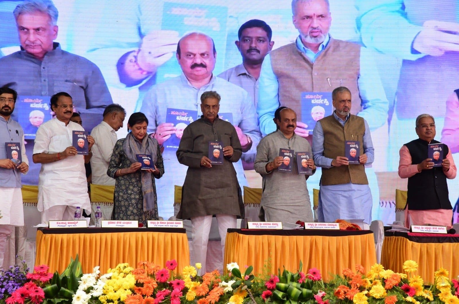 Book release on stage during the centenary