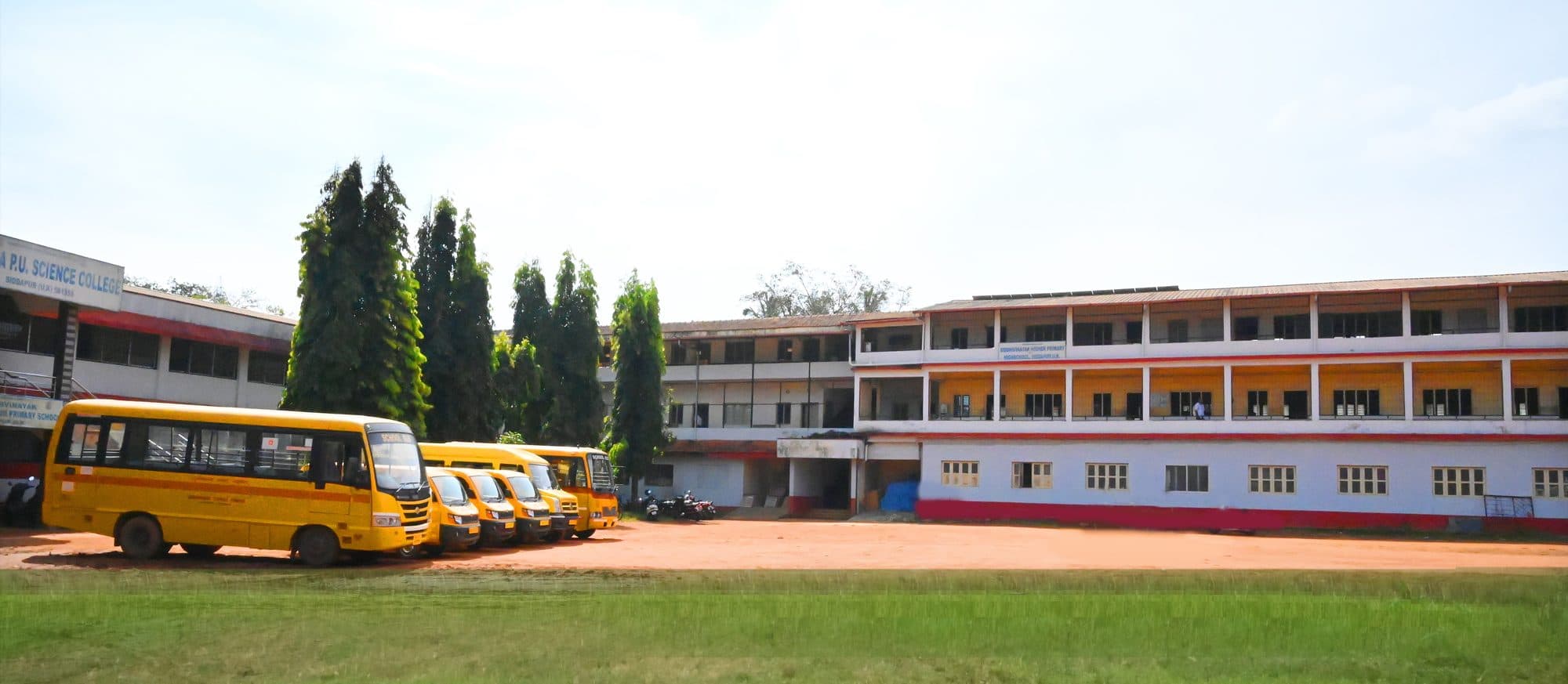 Siddhivinayak school campus in Siddapur with school buses